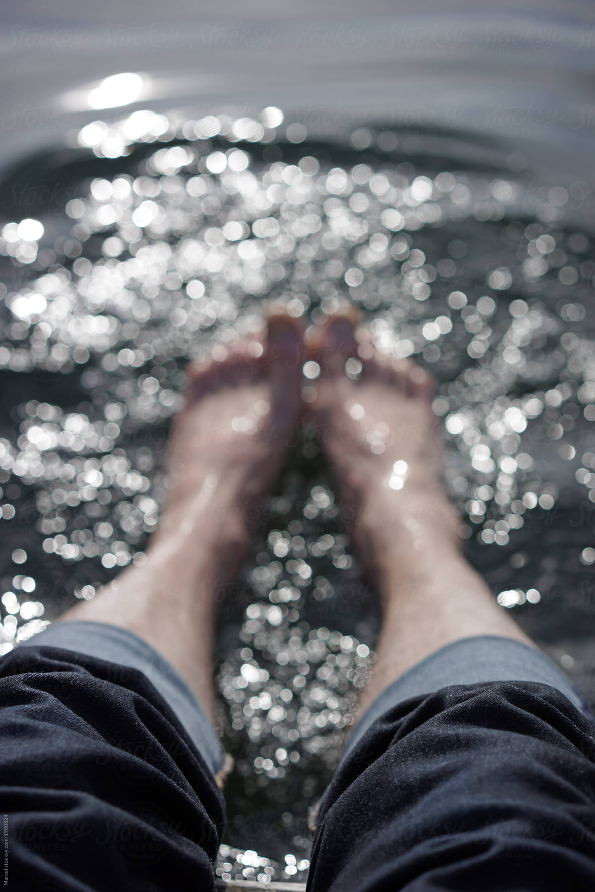Blurry feet in the sea, enjoying the water