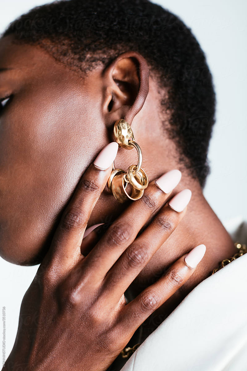 Crop black woman in stylish earrings