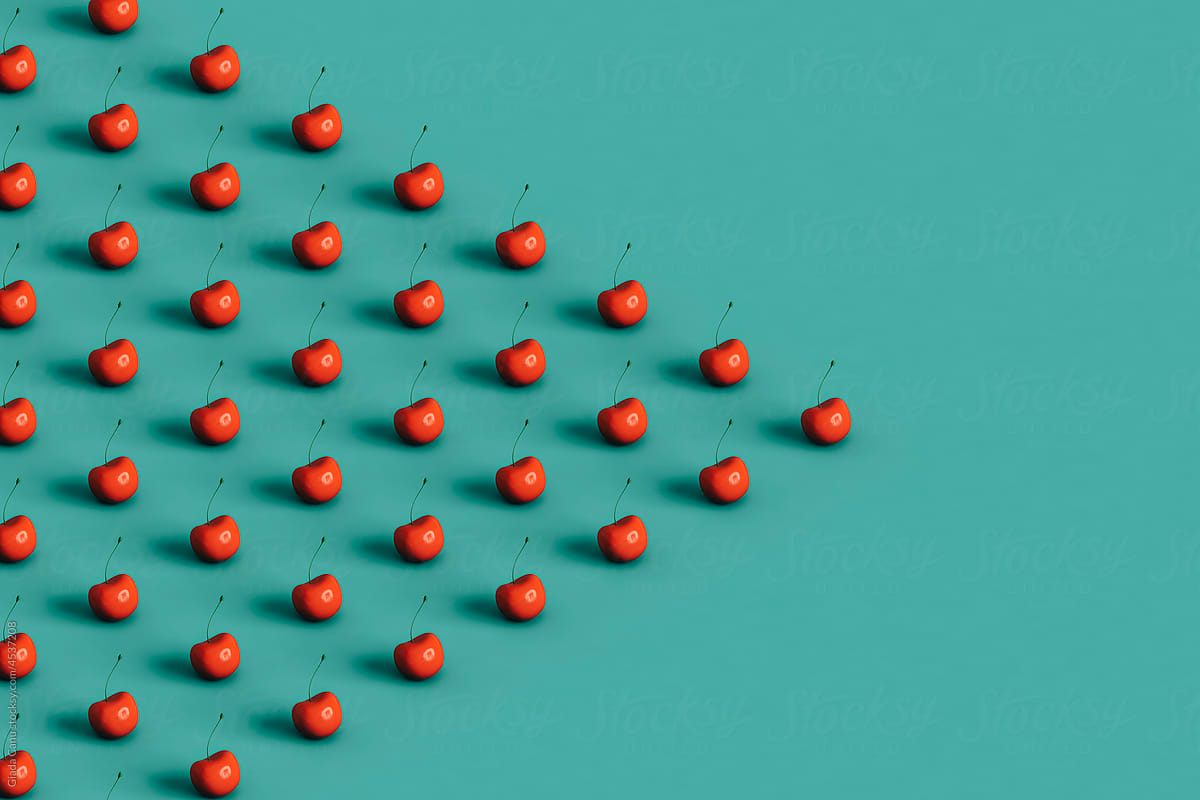 triangles of red cherries with copy space