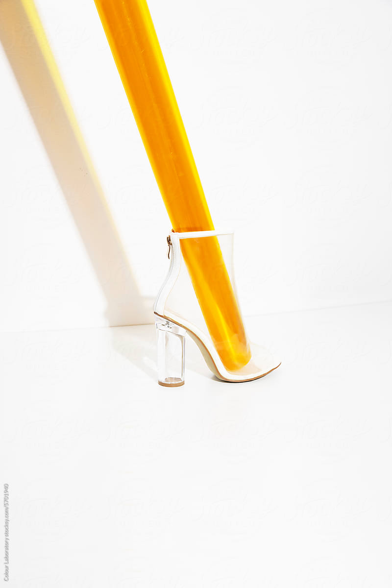 Transparent plastic high heel and yellow plastic inside it