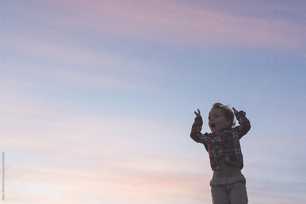 A Little Boy Yells Into the Sunset