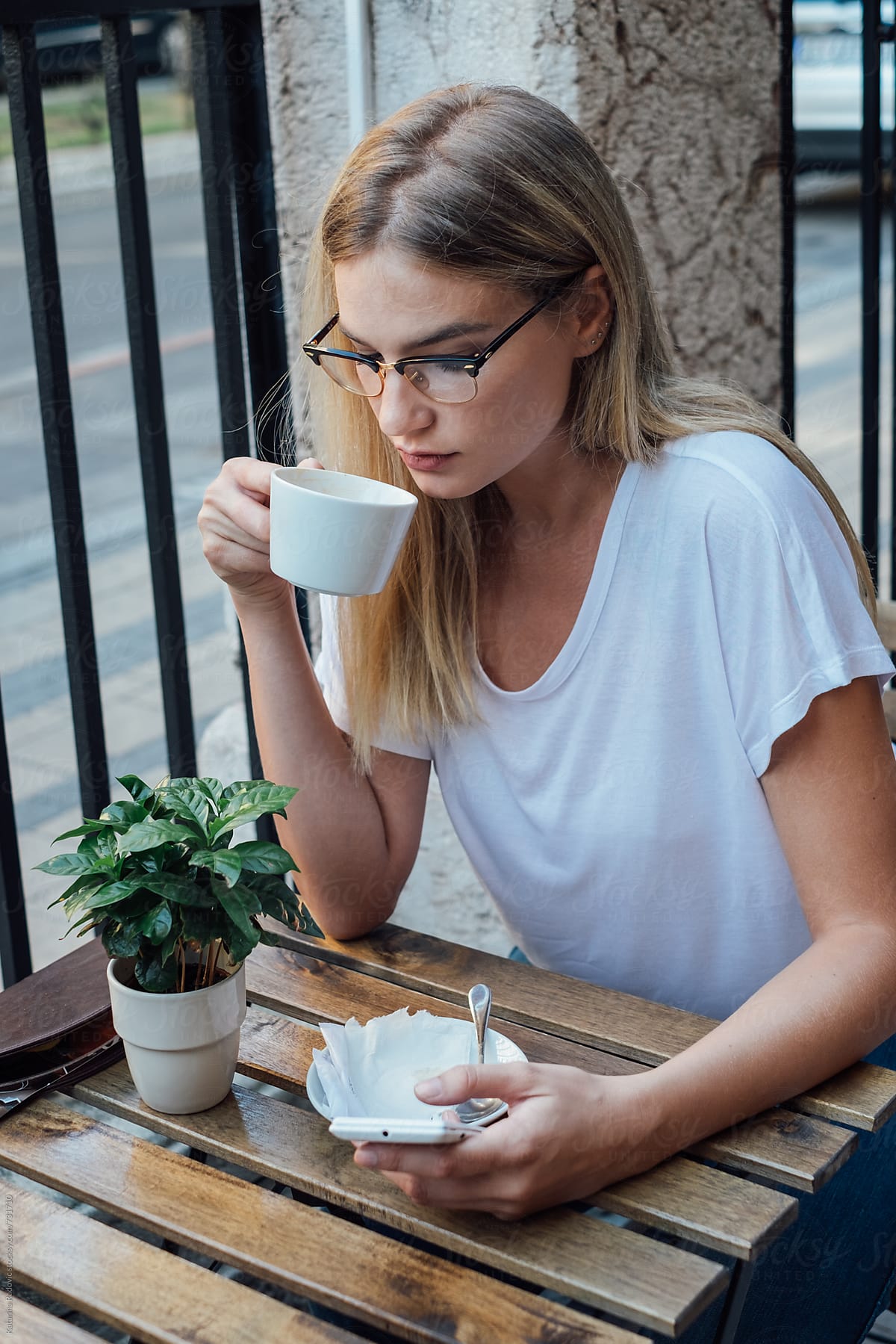 Pretty Blond Woman Having Coffee By Stocksy Contributor Katarina Radovic Stocksy