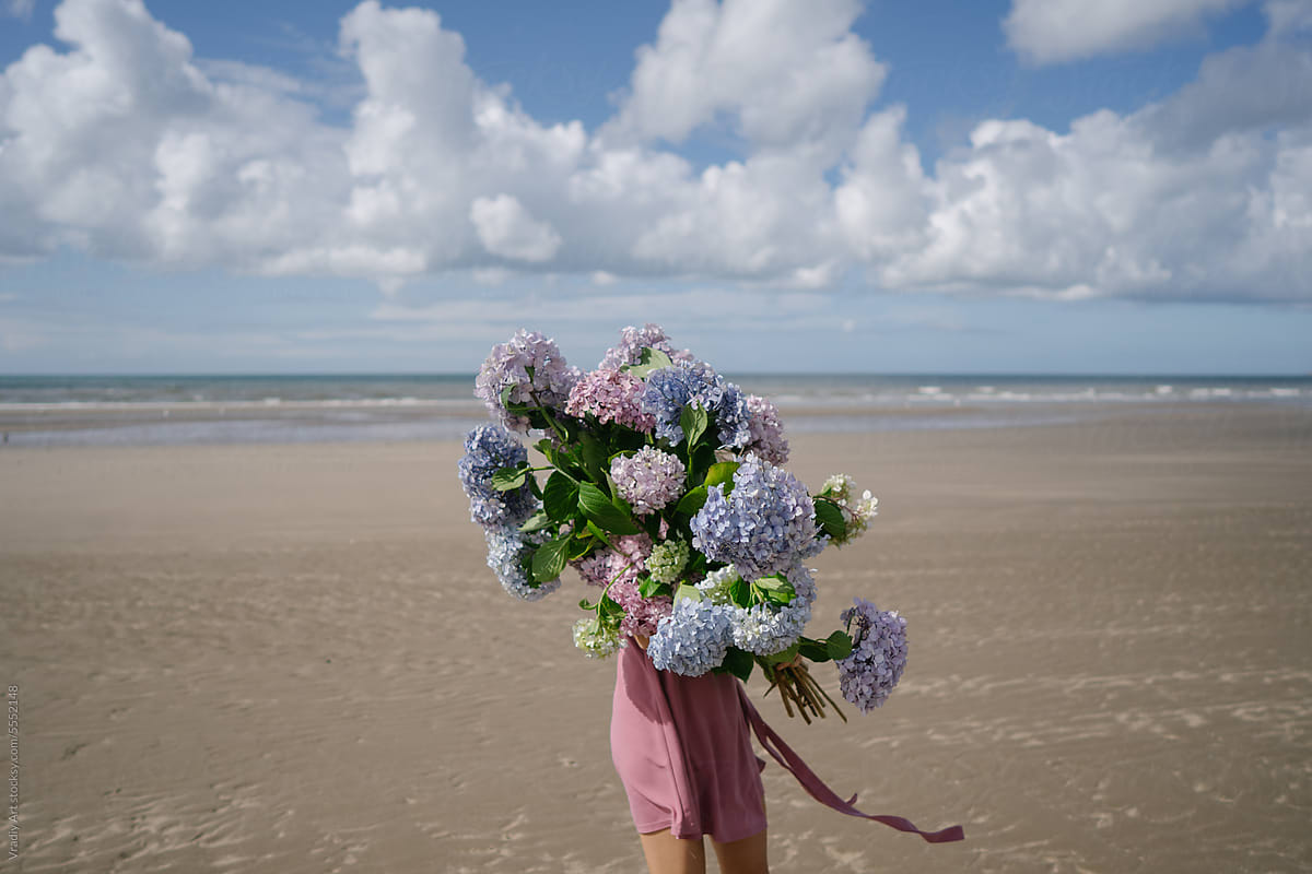Beautiful big bouquet of flowers on the beach