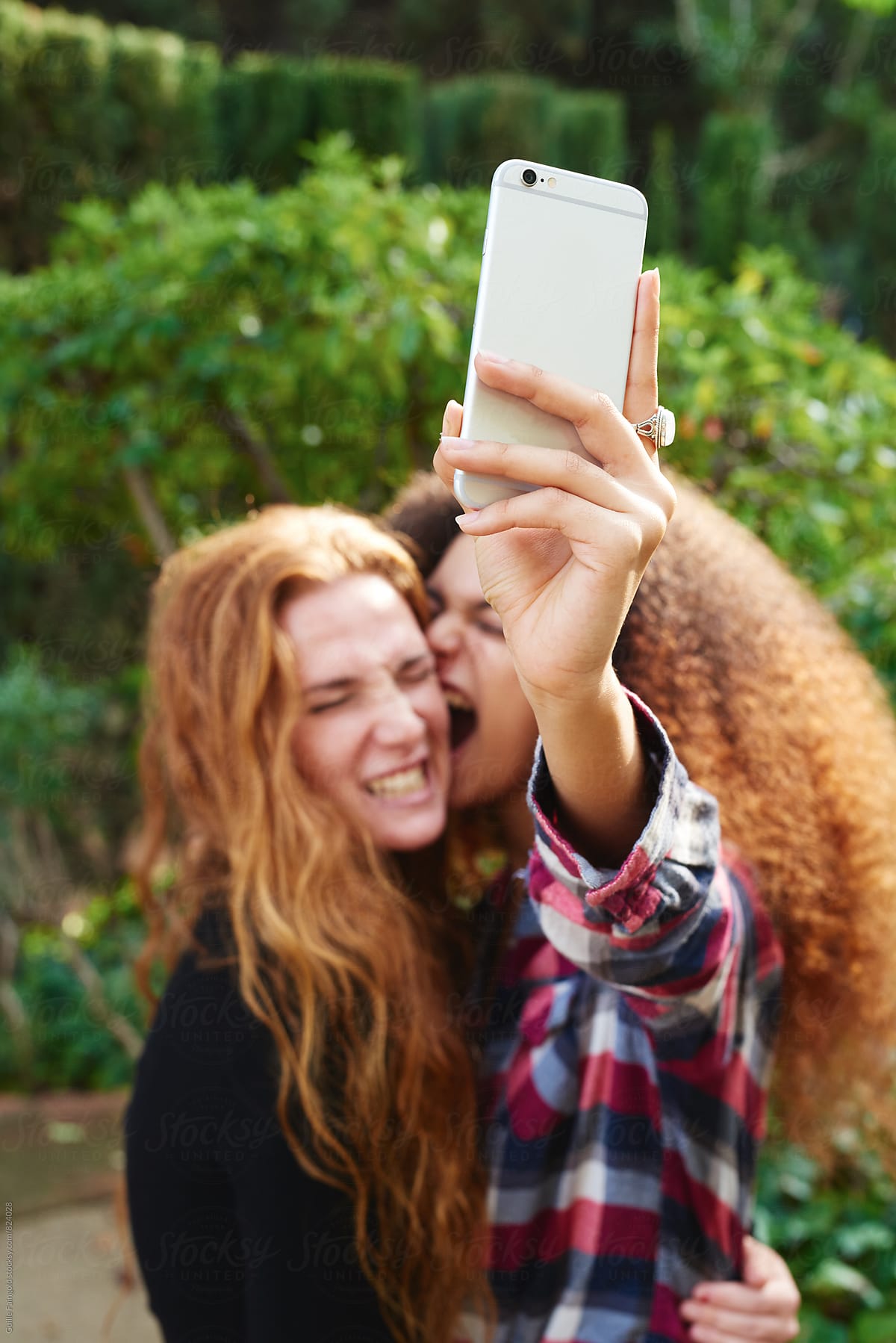 Emotional Girls Taking Selfie In Garden By Stocksy Contributor Guille Faingold Stocksy 9215