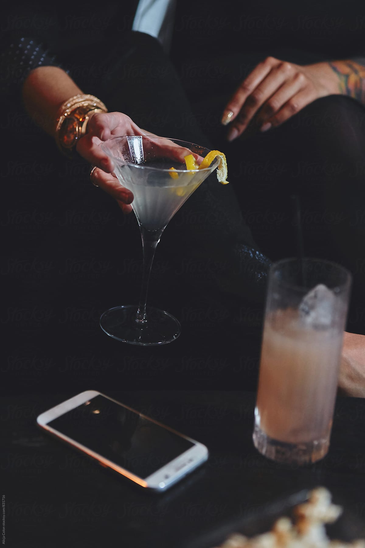 Hand holding a lemon martini