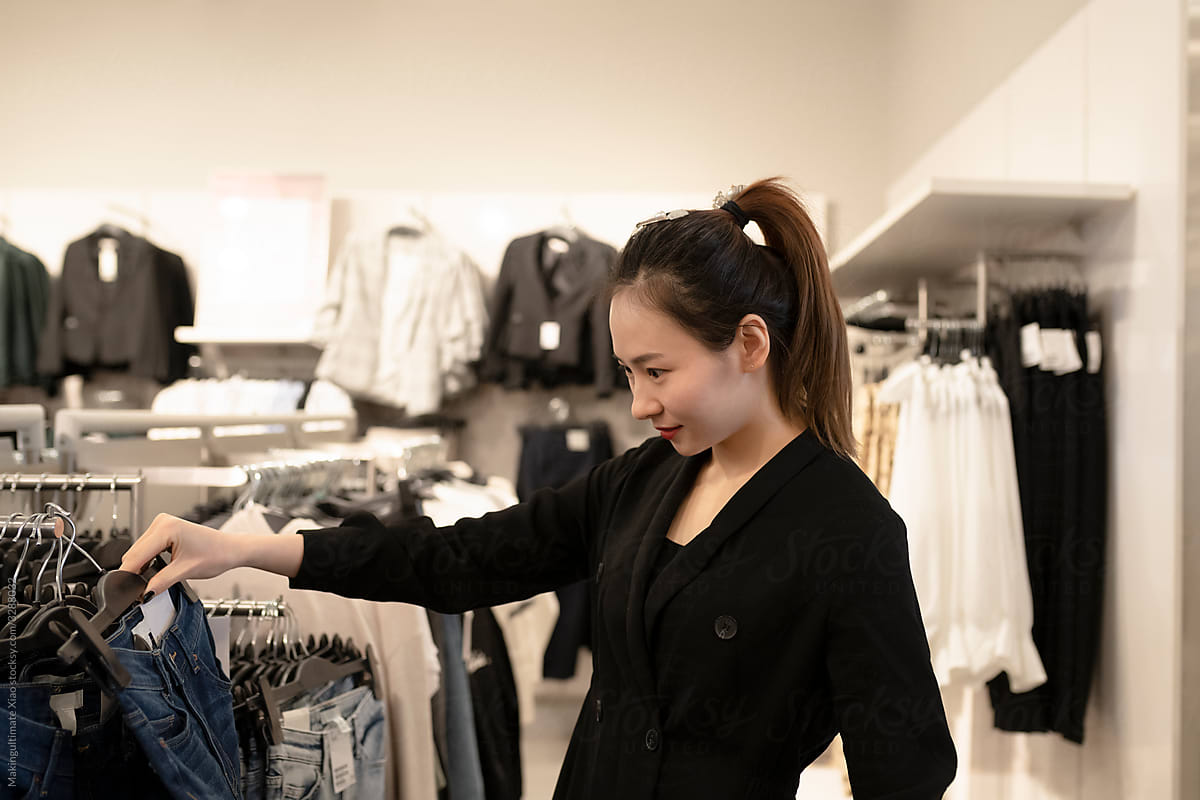A Chinese beauty is shopping in a clothing store