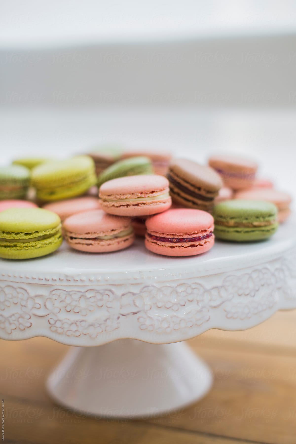 Colorful french macaroons on a cake stand