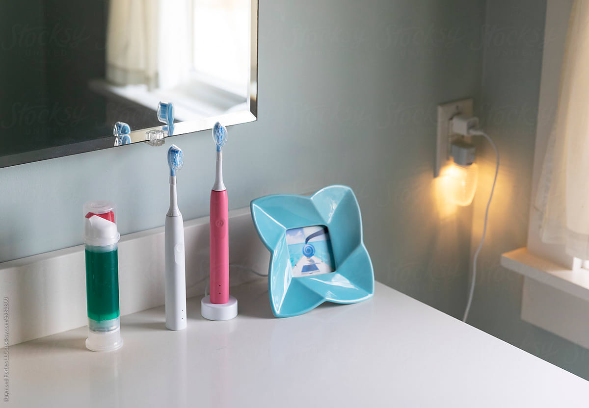 Electric Toothbrush and toothpaste  in bathroom of Home