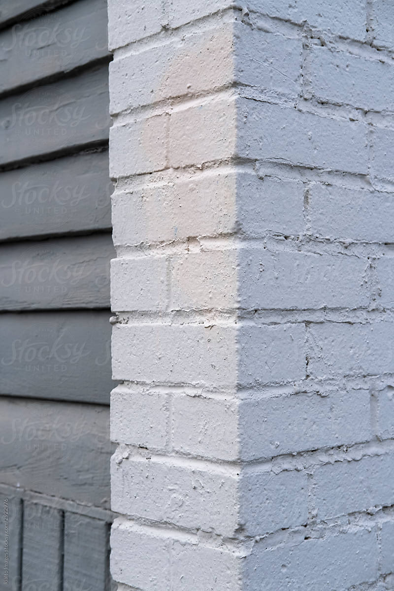 Exterior of grey brick wall and siding