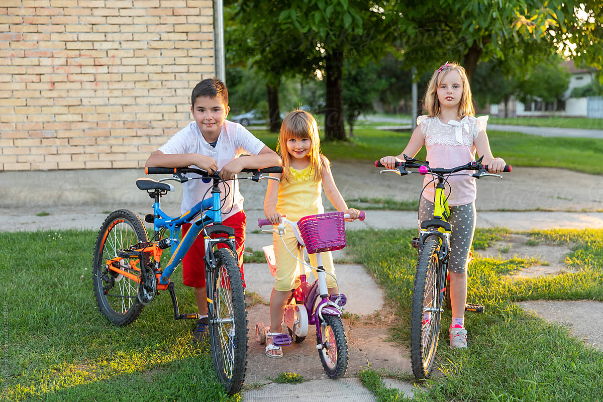 Kids riding a bicycle in neighbourhood