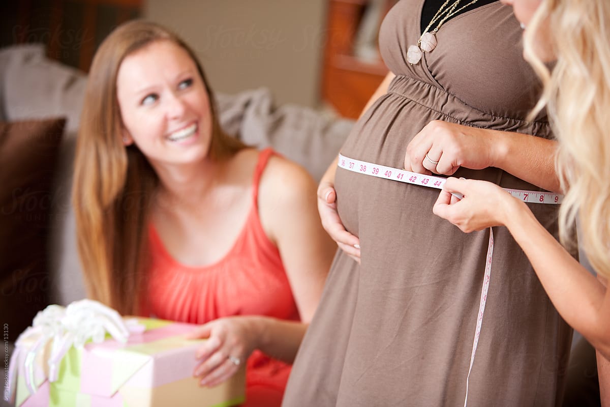 Baby Shower: Woman Laughing At Belly Size Game
