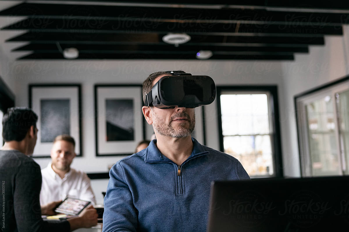 Business: Man In Cafe Using VR Headset To Do Work
