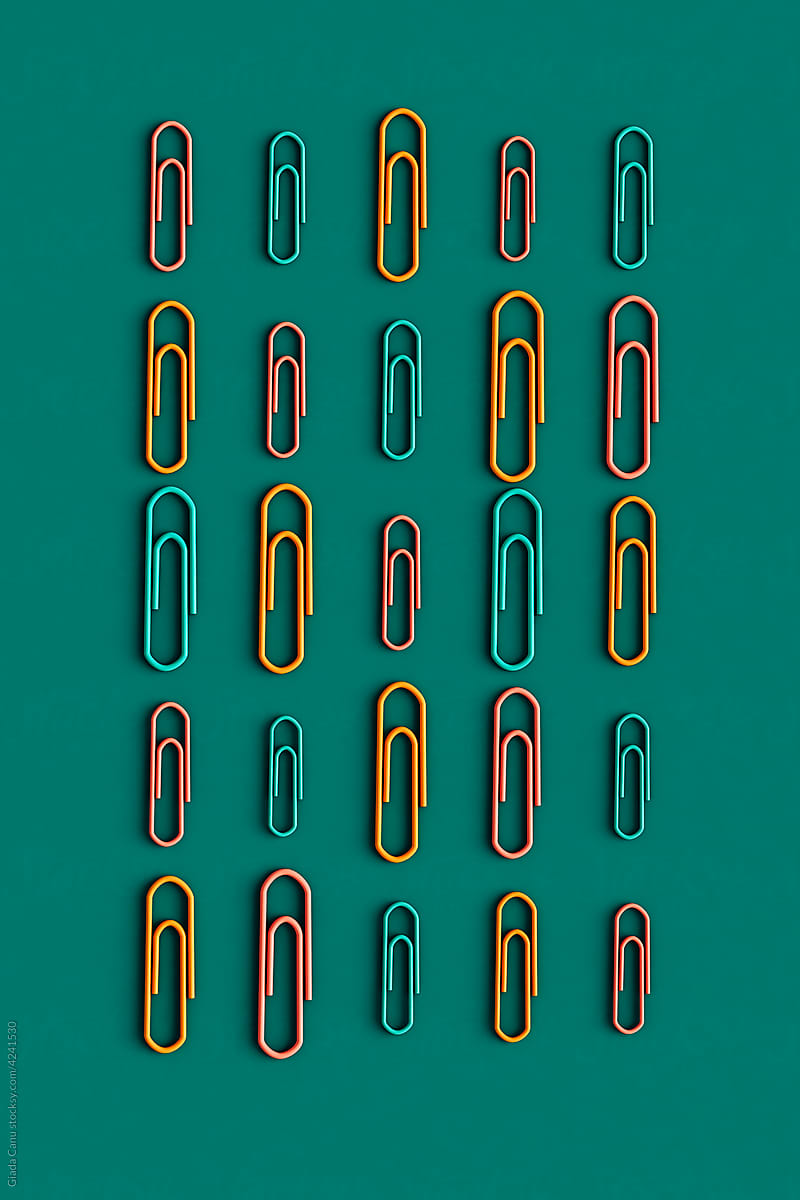 colorful paper clips in different sizes. from above