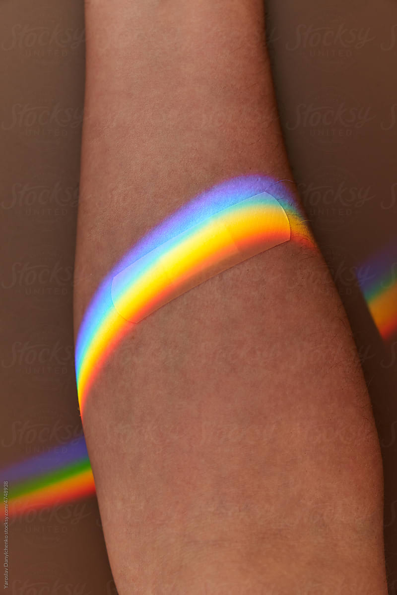 Adhesive plaster on skin in prism rainbow.