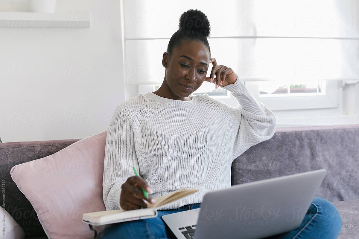 Young black woman studying from home