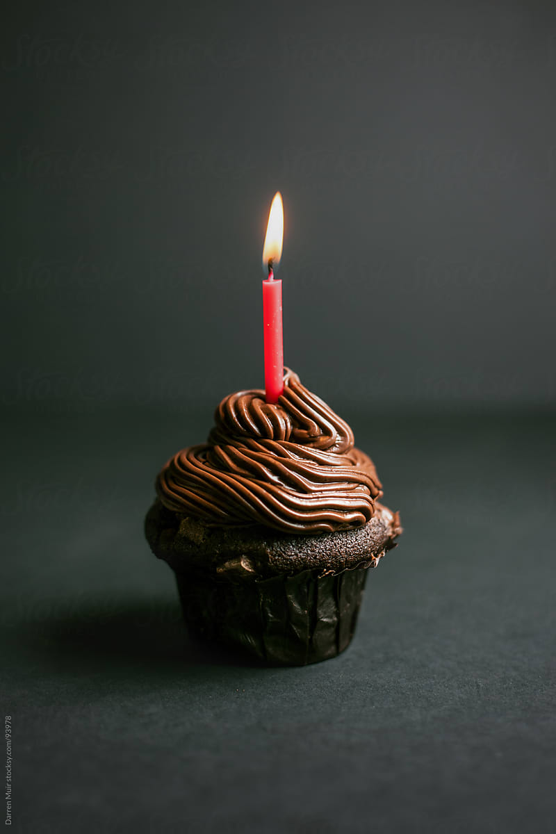 Cupcake with candle. - Stock Image - Everypixel