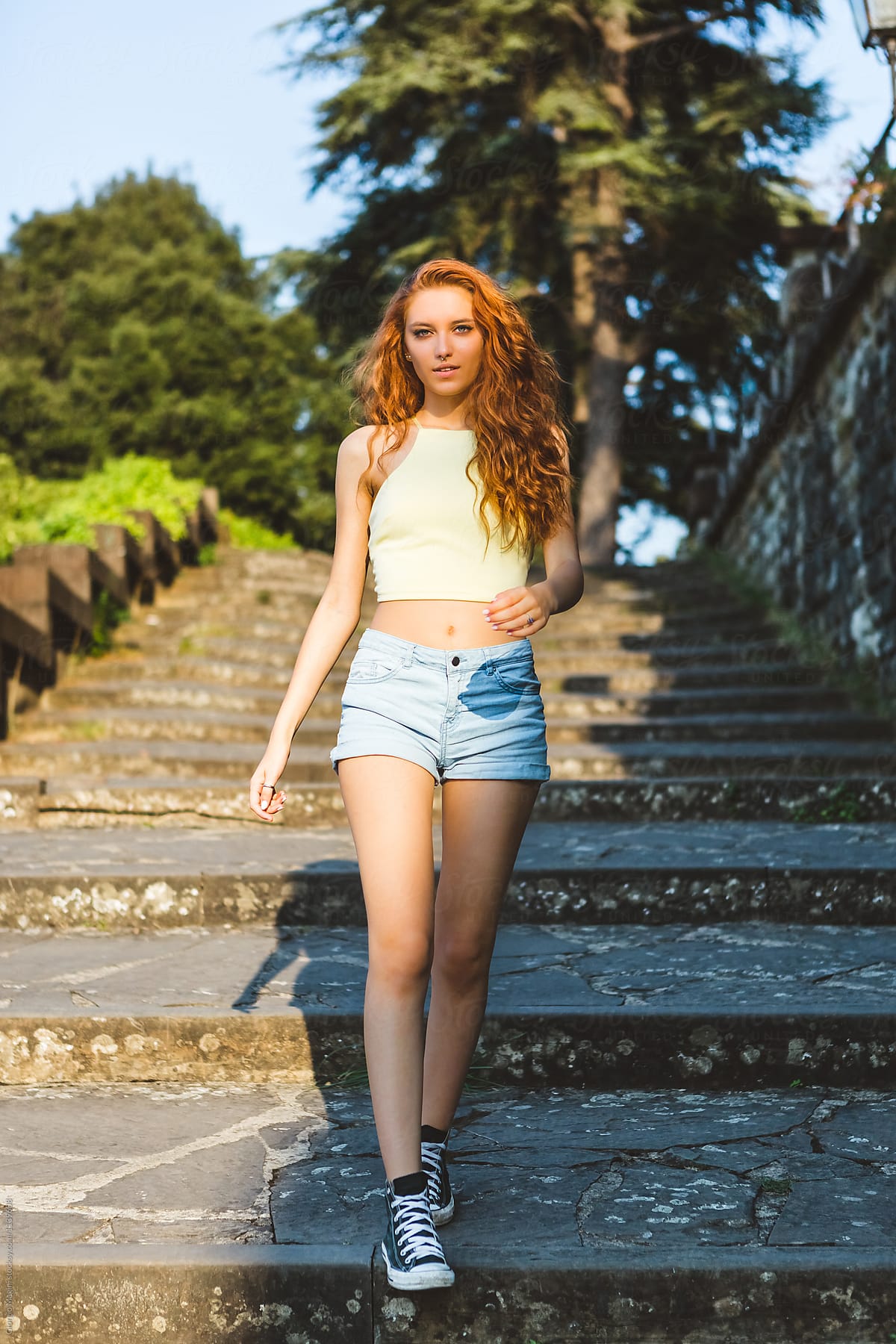 Beautiful Young Redhead Descending Outdoors Staircase
