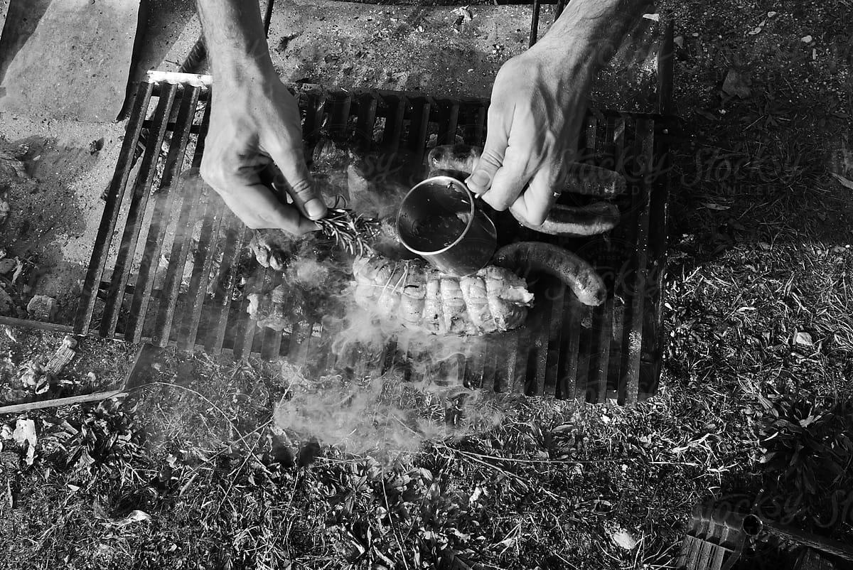 Man\'s hands preparing barbecue