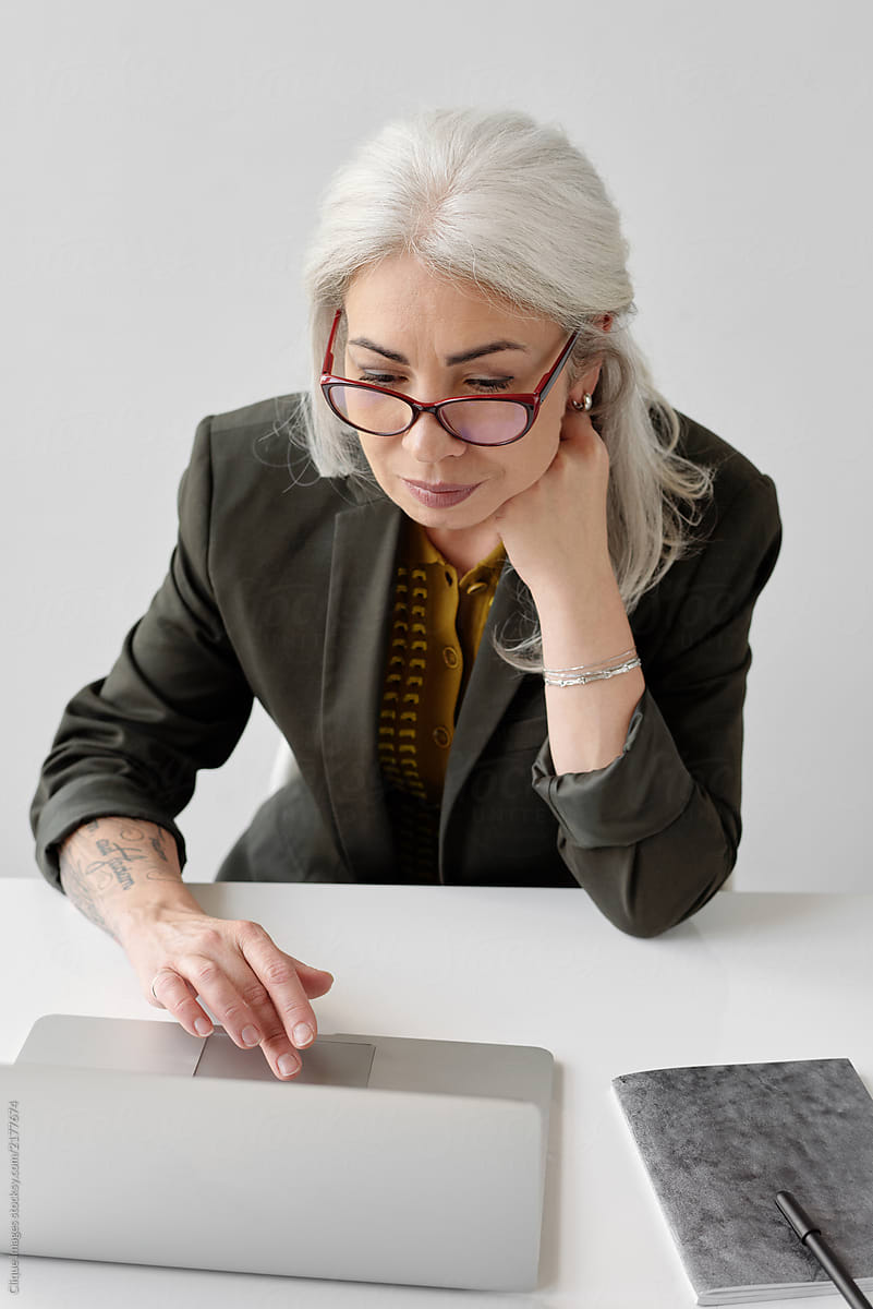 Stylish Elderly Woman Using Laptop