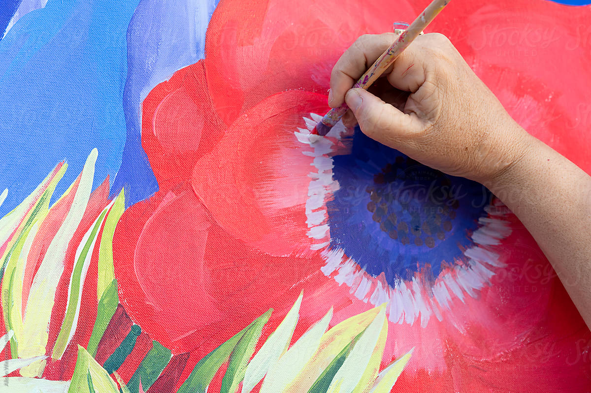 Up close of hand painting on a floral canvas