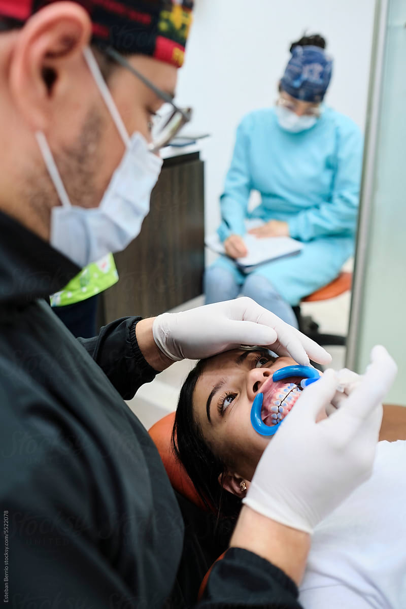 Dentist doing a dental cleaning