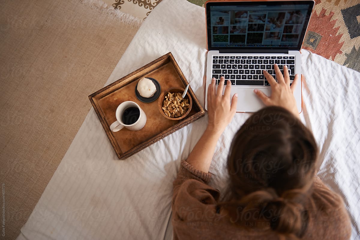 Anonymous Female Using Laptop During Breakfast On Bed By Stocksy Contributor Guille Faingold 6420