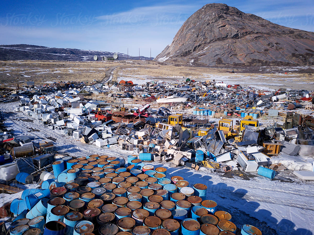 Greenland waste dump for fossil fuels, oil barrels, trash and rubbish disposal