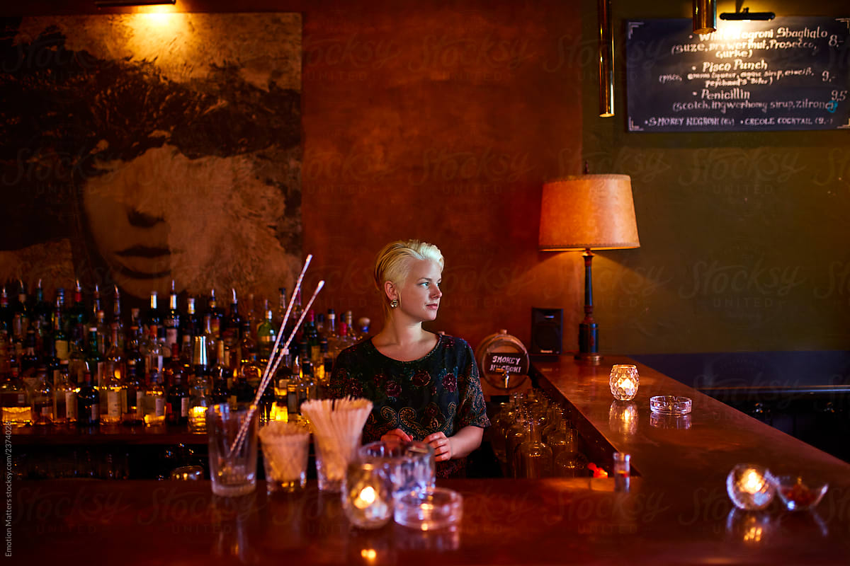 A lady working by the bar.