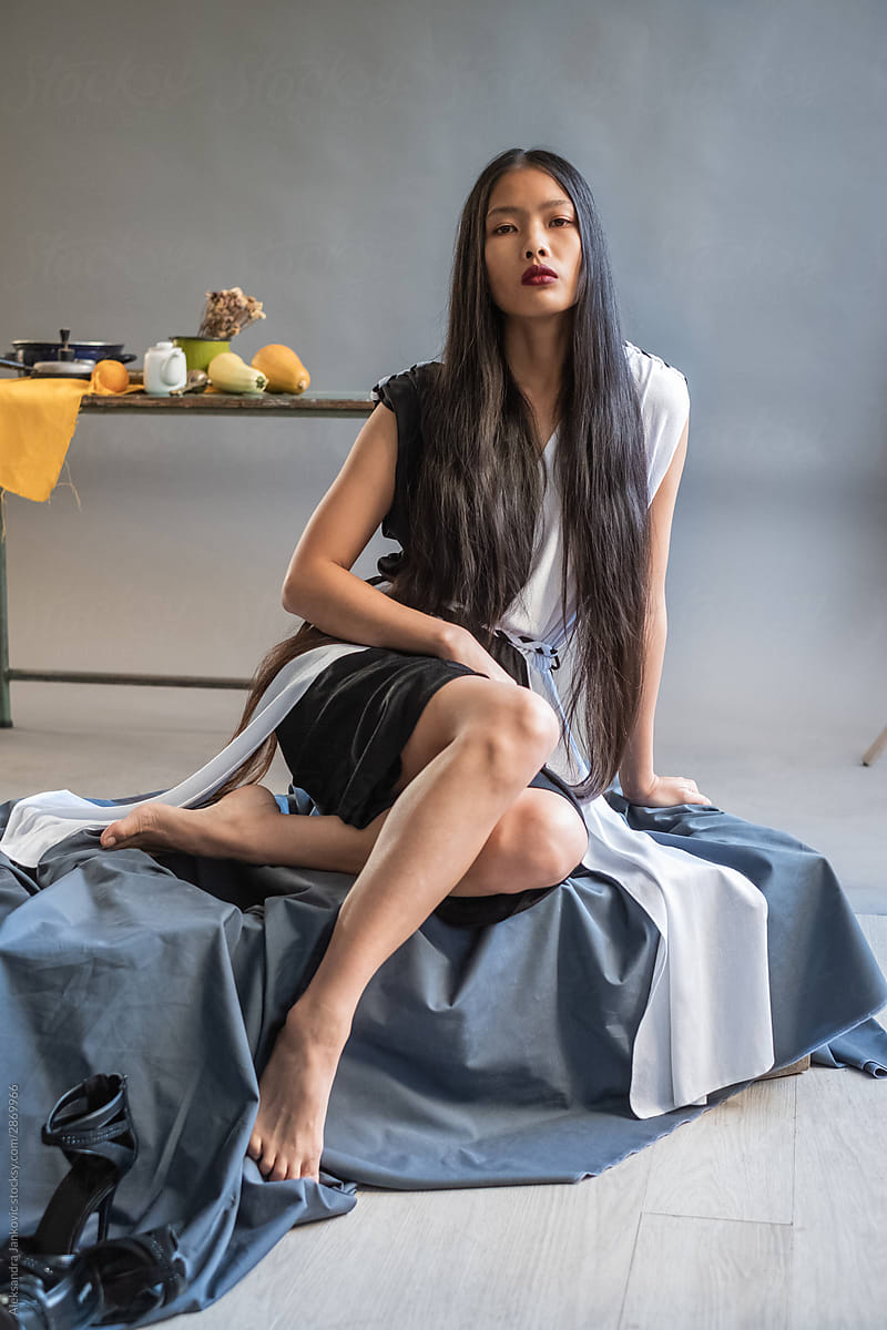 Fashionable Asian Woman Posing In The Art Studio