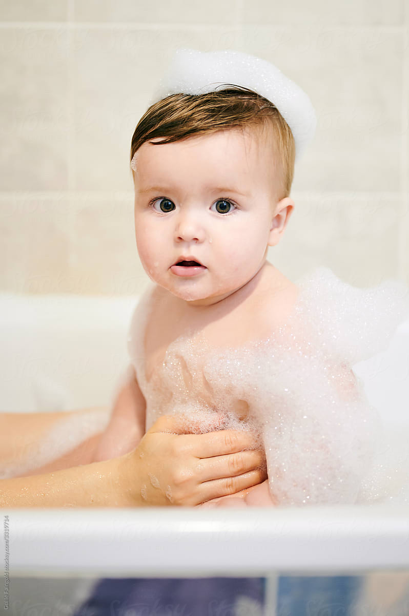Baby sitting in bath