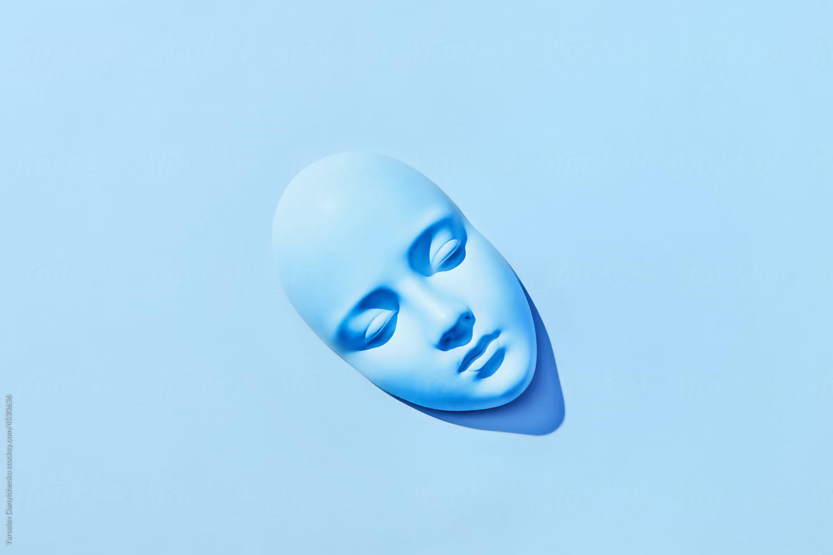 Blue mask with neutral facial expression