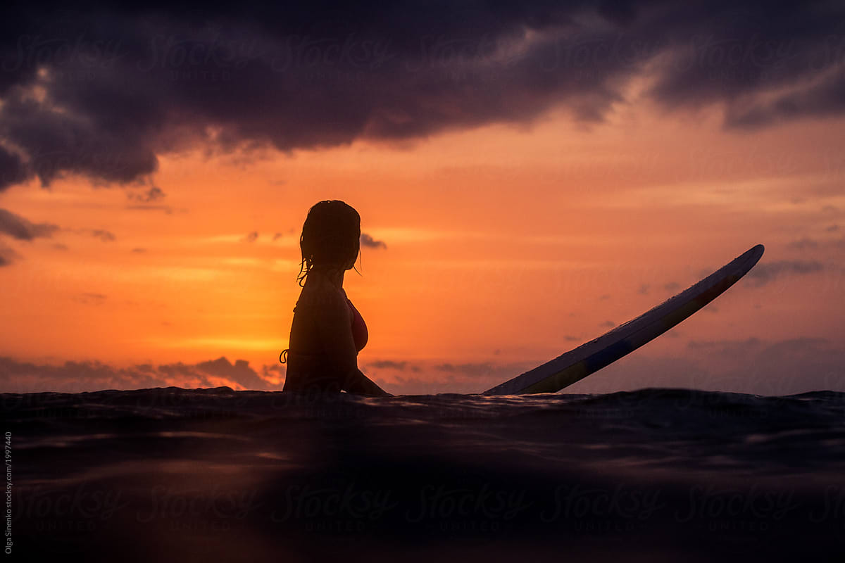 Woman S Silhouette Sunset Surf In Bali By Stocksy Contributor Olga Sinenko Stocksy