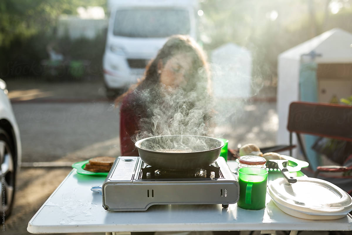 woman cooking in a campsite
