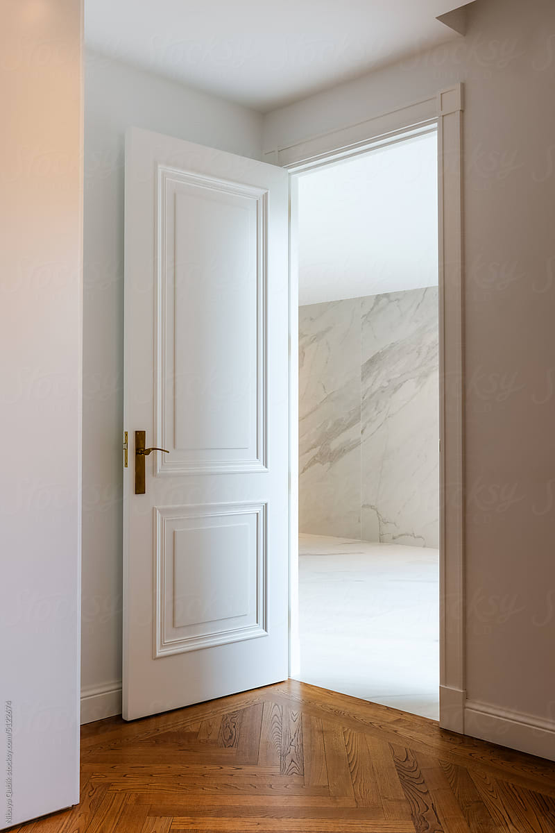 Open white door room entrance. Modern and minimal interior design