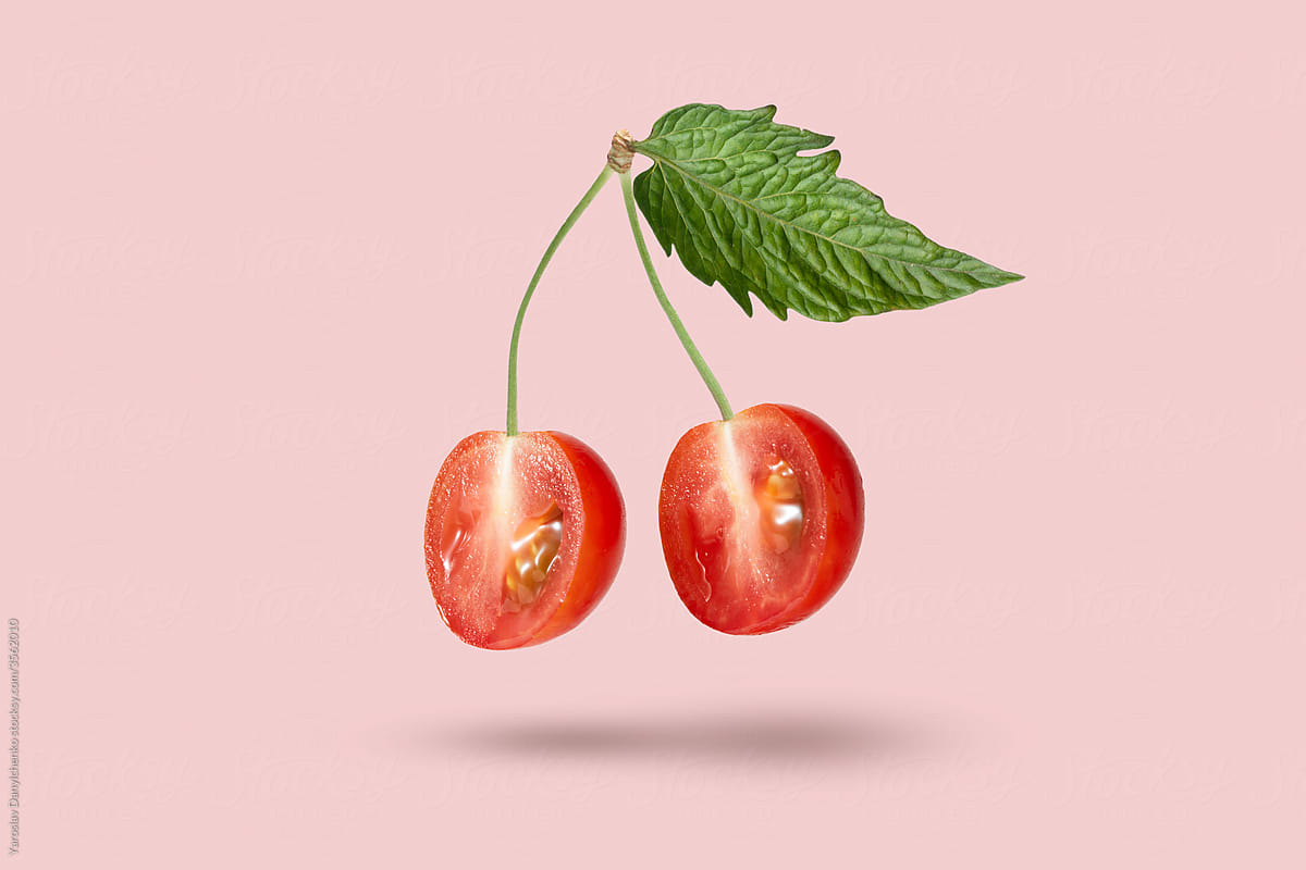 Floating cherry fruit from cut tomatoes halves.