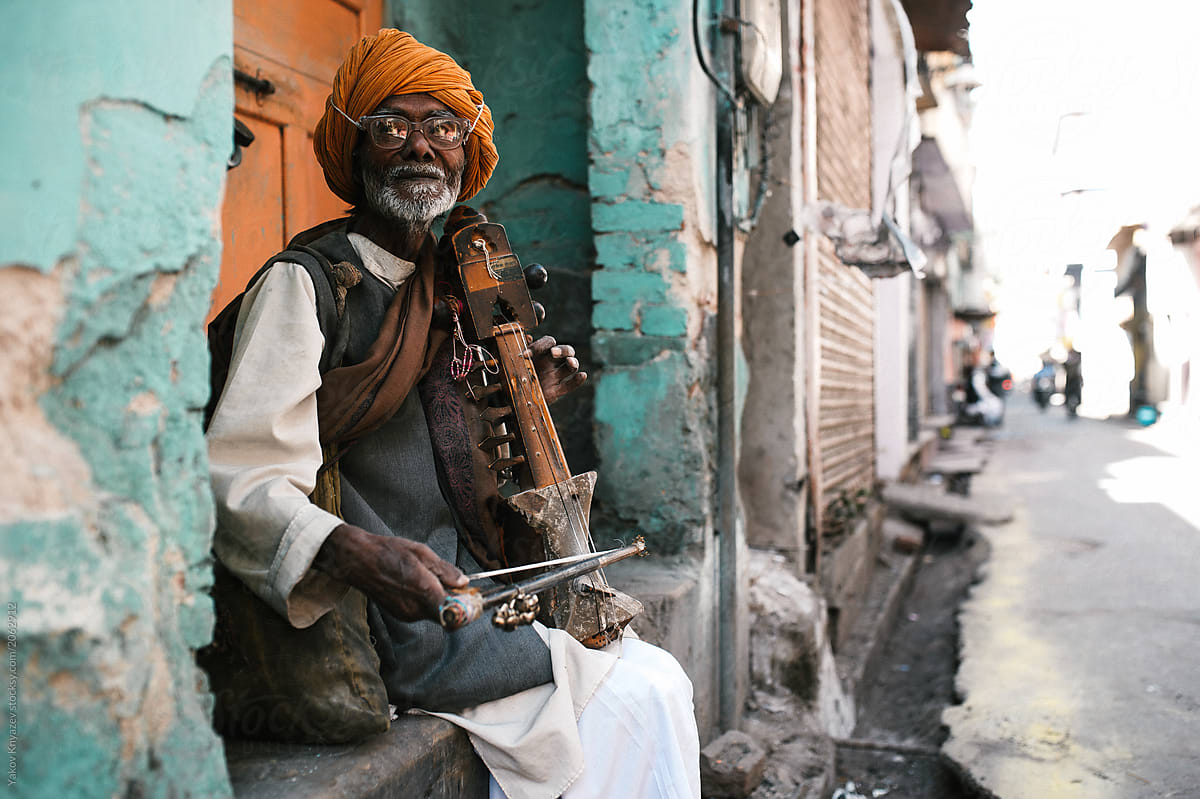 Indian street musician playing sarangi