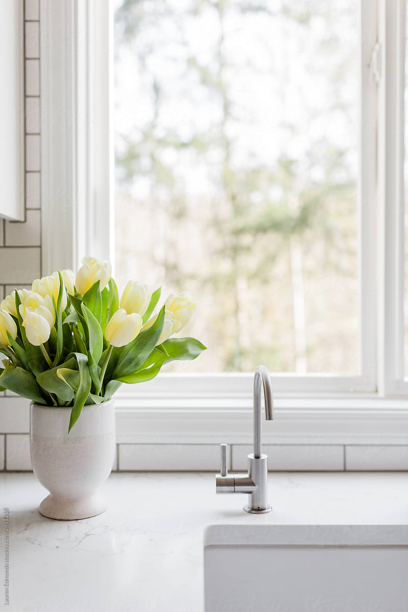 Vase of Yellow Tulips in White Contemporary Kitchen