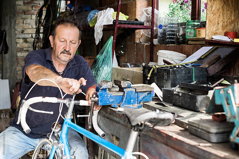 Man Repairs a Bike