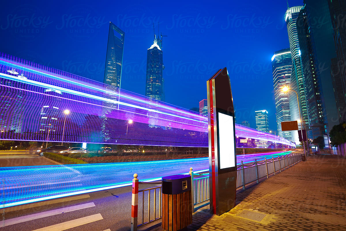 The highway car light trails of modern urban buildings