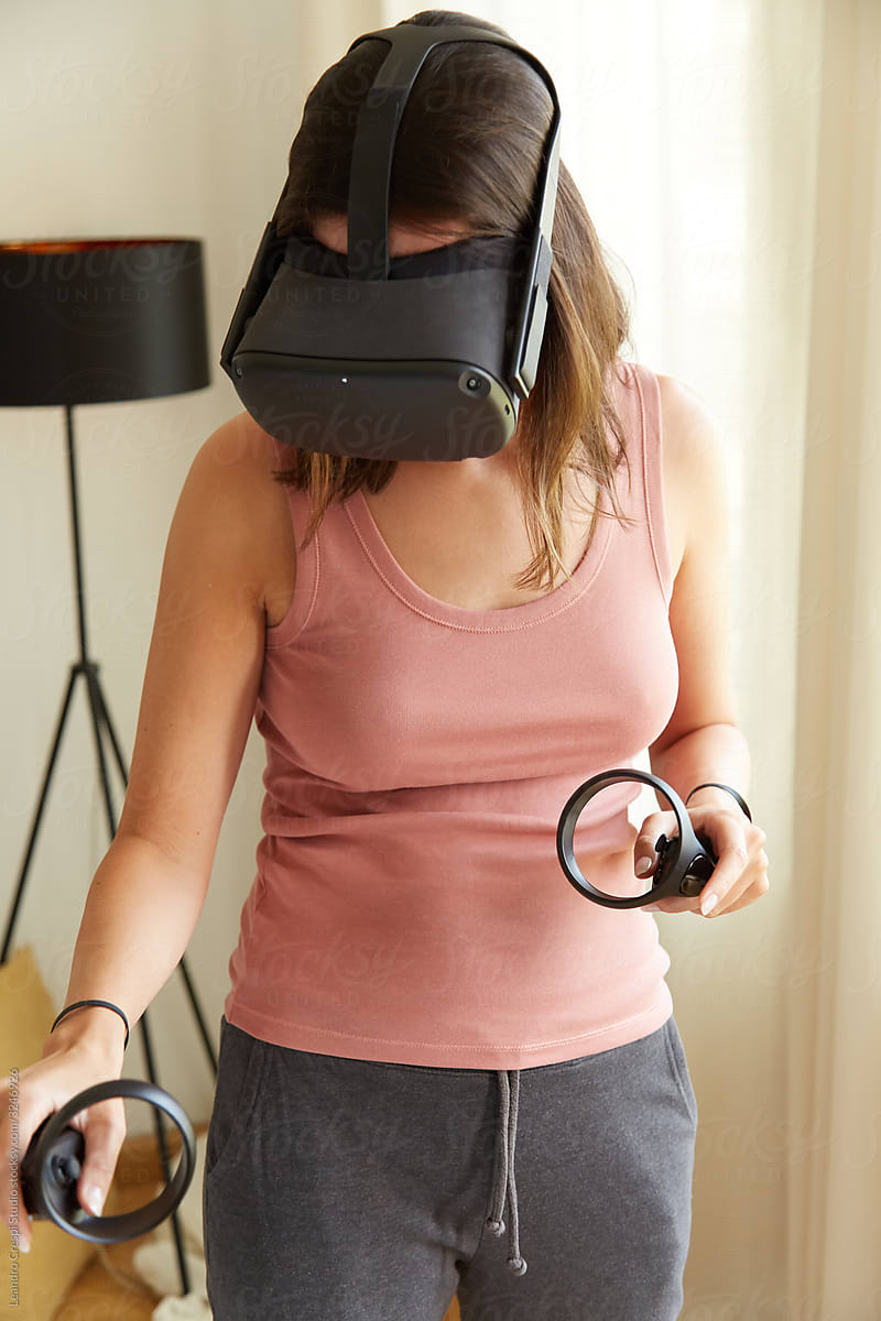 Woman playing with VR at home