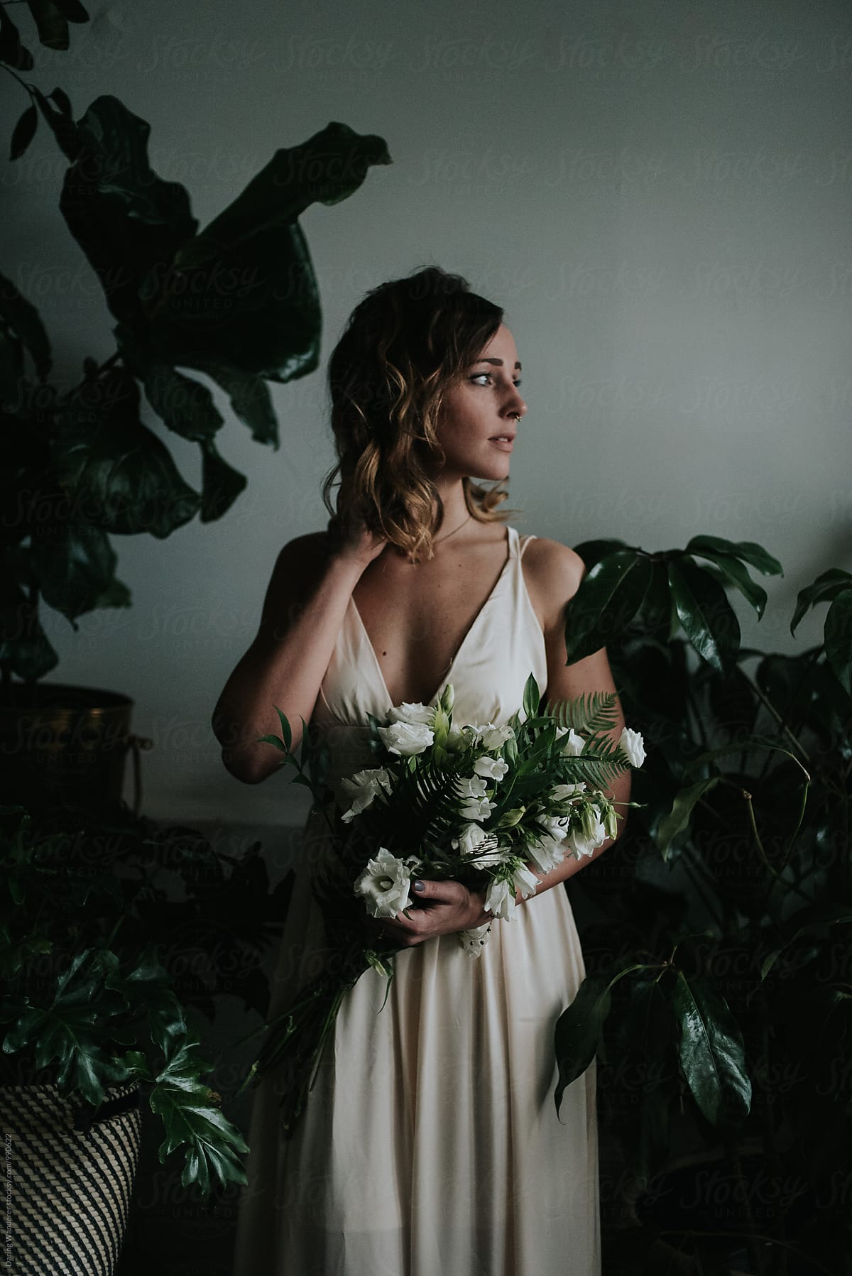 Moody bridal portraits in a tropical botanical flower shop