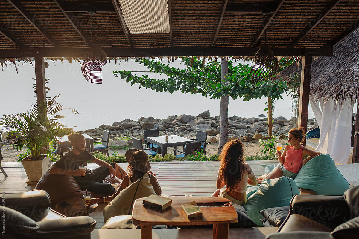 Group of Friends in a Beach Bar overlooking the ocean
