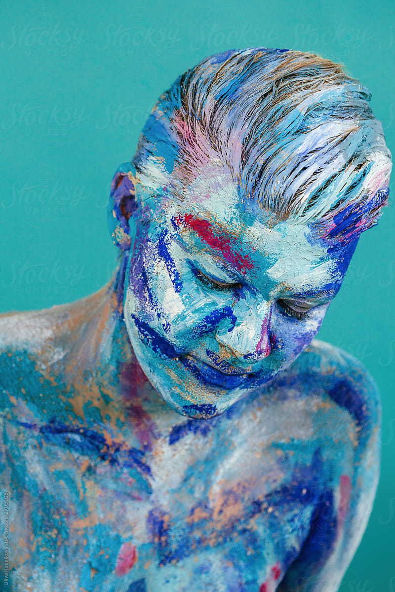 Blue and pink body art on turquoise background