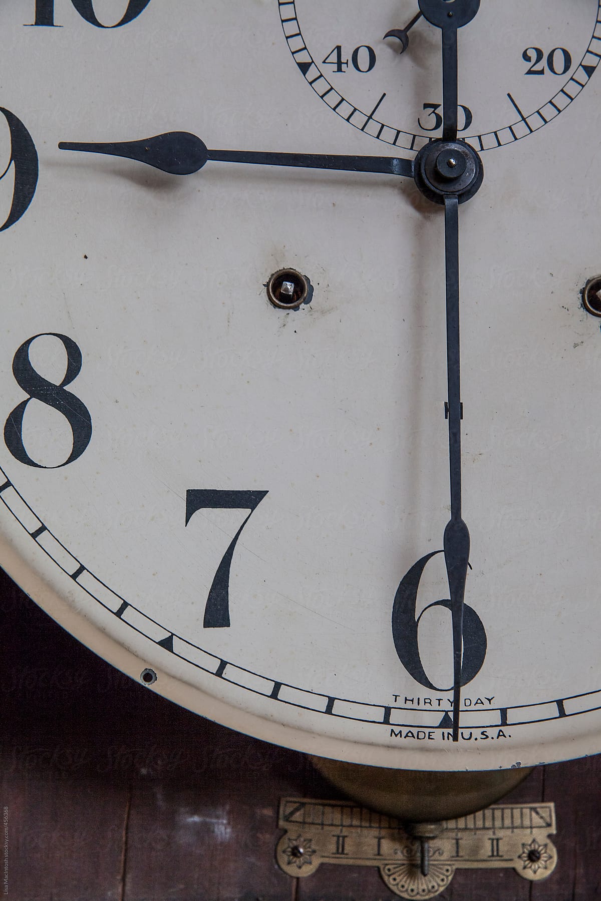 face, hands and pendulum of antique clock