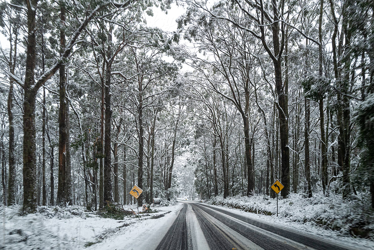 POV of driving on snowy and slushy road in country Australia