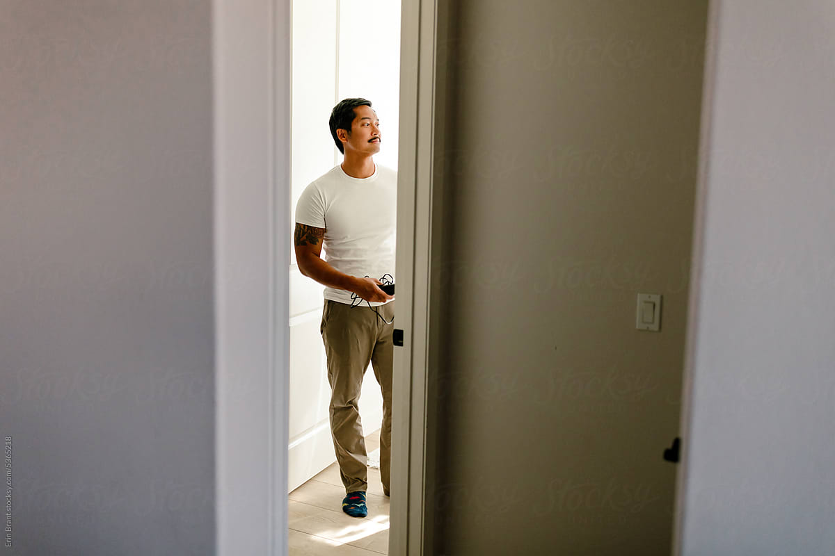 Man stands in door frame