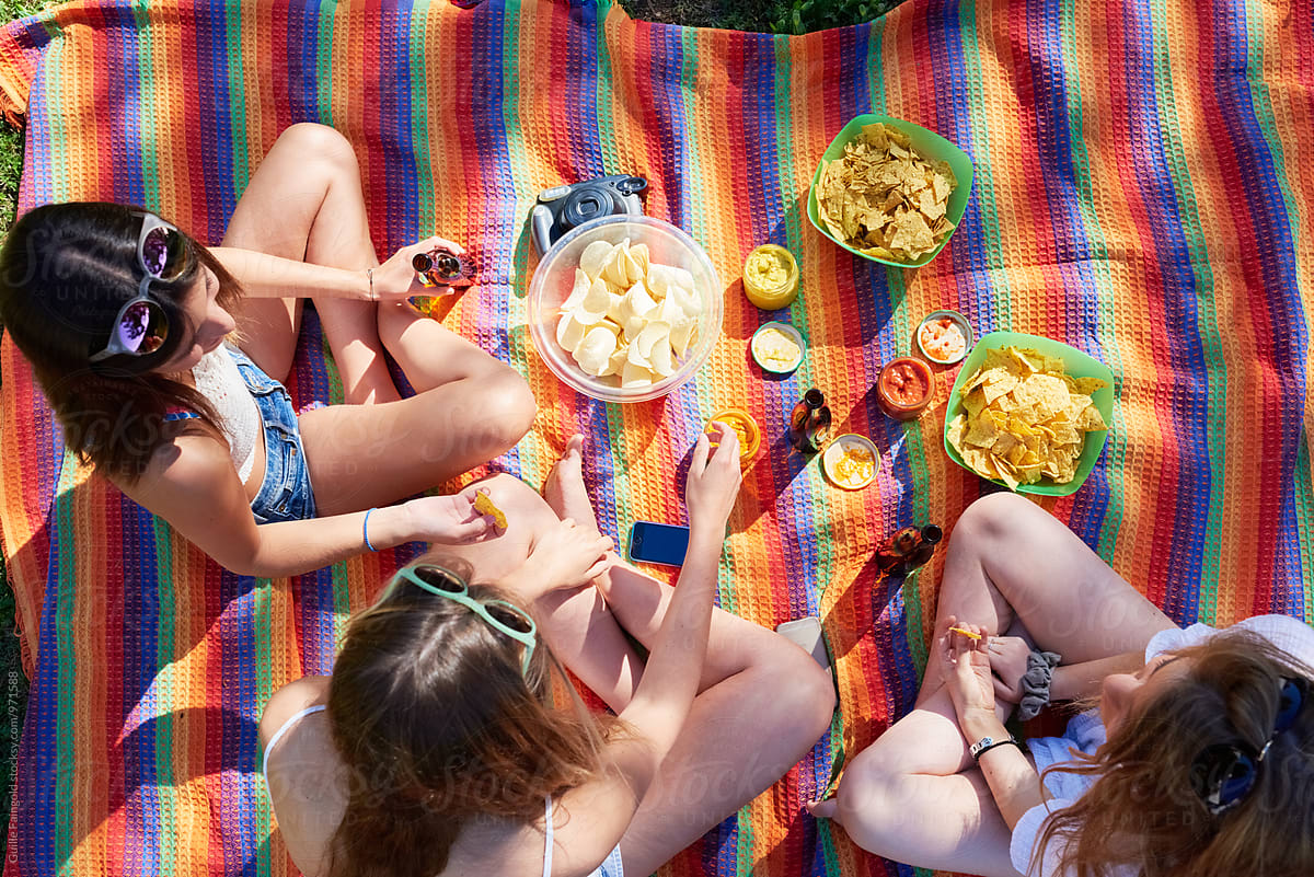 Summer. Three friends having picnic