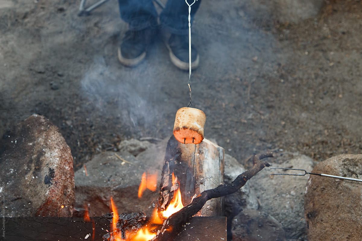 Roasting a marshmallow over an open flame