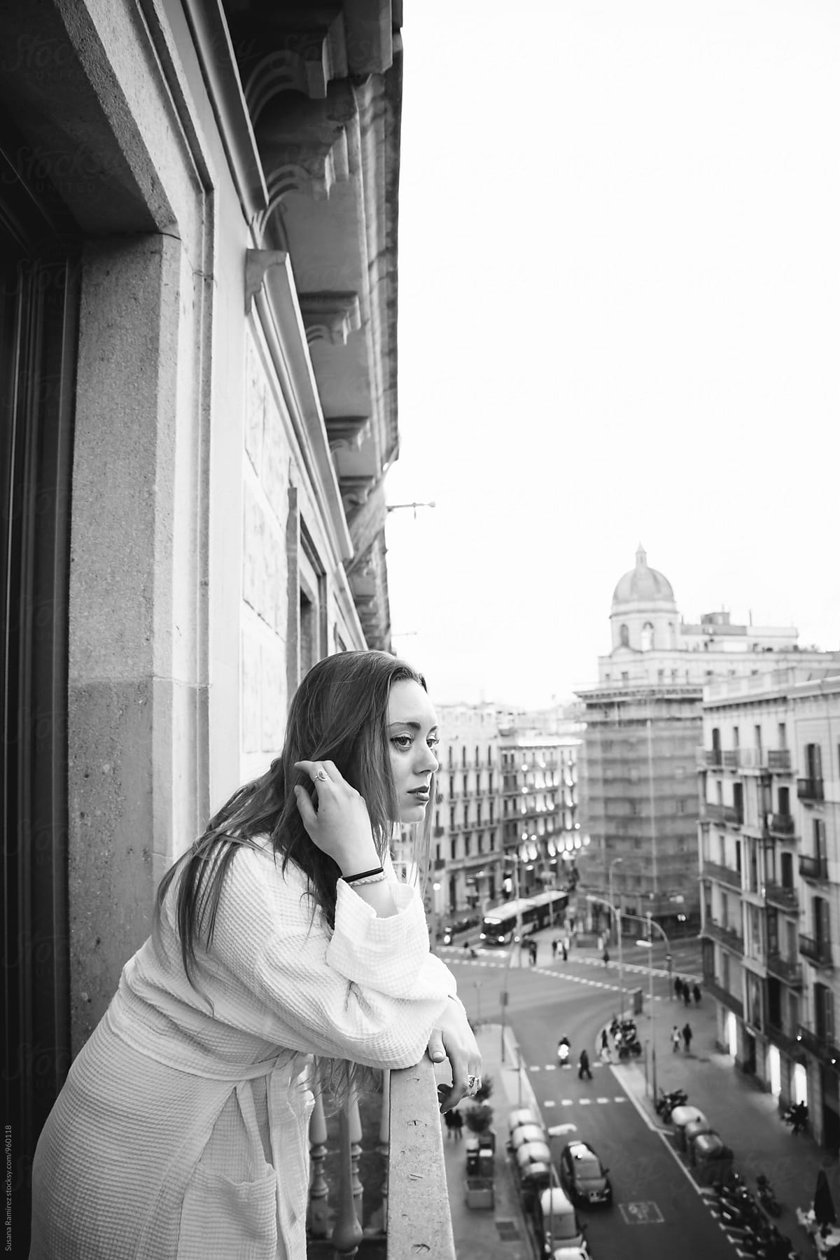 Portrait of woman on the balcony with bathrobe