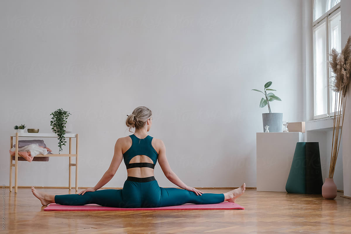 Focused Female Achieving Balance Through Yoga